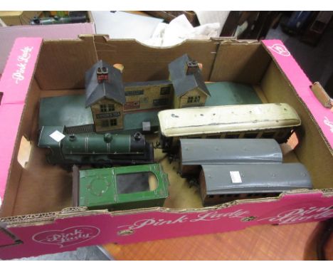 Bing 0 gauge clockwork engine (a/f), three various carriages, a station and a platform timetable display cabinet