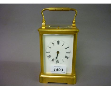 Late 19th / early 20th Century French gilt brass carriage clock, the enamelled dial with Roman numerals, the two train hour r