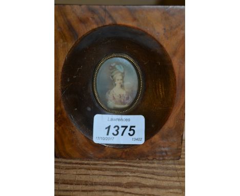 Miniature oval watercolour portrait of a lady, housed in a rectangular walnut frame