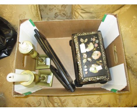 Victorian black lacquer and mother of pearl inlaid tea caddy, similar inlaid book rack and a pair of brass candlesticks
