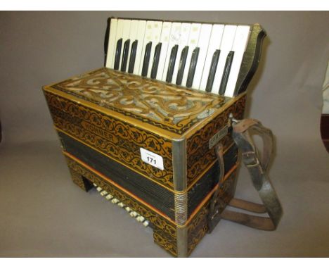 Hohner accordion with leather straps and twenty four buttons (a/f)