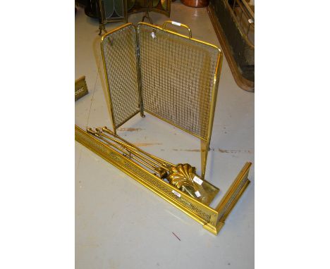 Small pierced brass fireplace fender, firescreen and quantity of fire tools