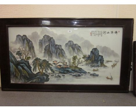 Large 20th Century Chinese porcelain plaque painted with a river landscape, Chinese script and red seal marks, housed in a ha