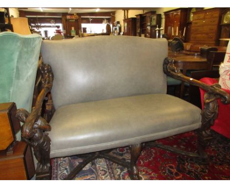 Unusual 19th Century Continental walnut two seat sofa, the upholstered back and overstuffed seat covered in grey leather, the