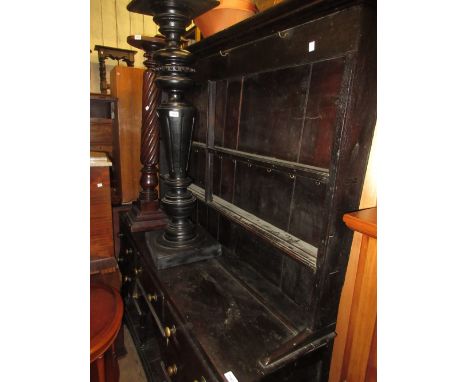 Late 19th Century oak dresser, the two shelf back above an arrangement of five drawers with pot shelf, raised on turned suppo