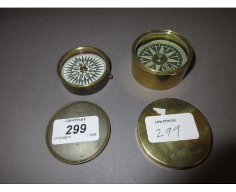 Small circular brass compass with paper dial, together with a similar plated on brass compass