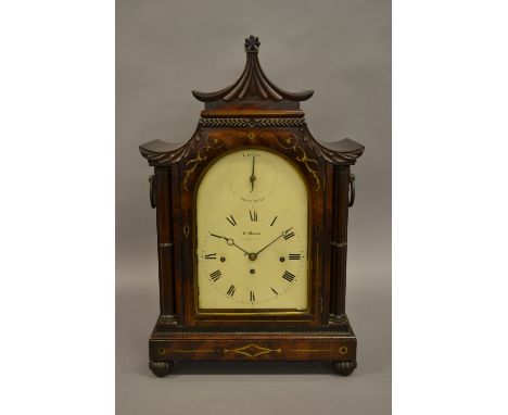 Regency mahogany and brass inlaid bracket clock, the pagoda case with a shaped pediment and flanking cluster columns above a 