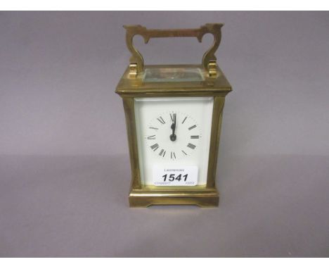 20th Century brass cased carriage clock with an enamel dial, Roman numerals and single train movement