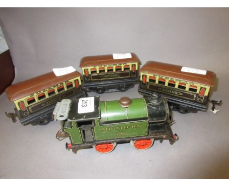 Hornby 0 gauge clockwork 0-4-0 tank engine and three Pullman coaches