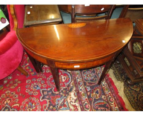 George III mahogany and inlaid half round fold-over card table raised on square tapering supports