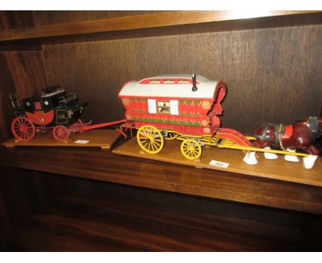 Two painted wooden scale models of horse drawn carriages