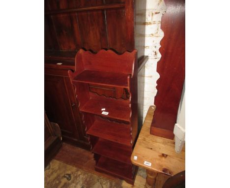 Pair of small mahogany narrow five shelf open bookcases