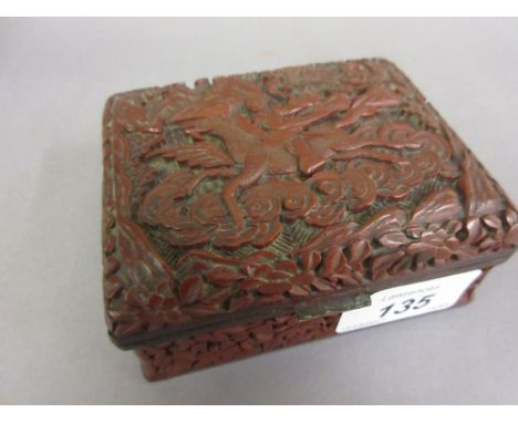 Chinese red cinnabar box with hinged cover, signed with seal mark to base