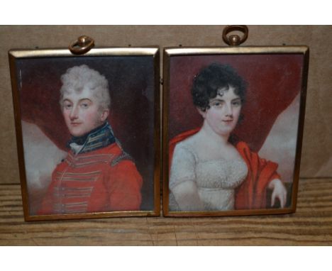 Early 19th Century English school, pair of rectangular portrait miniatures on ivory of an army officer and his wife, unsigned