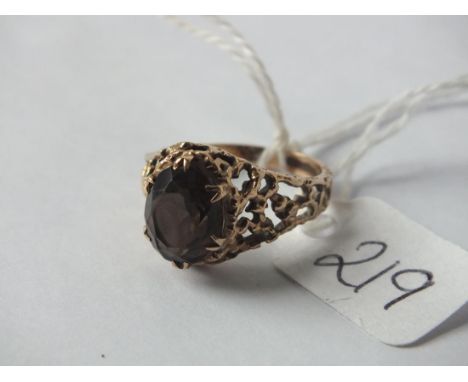 9ct brown stone dress ring with fancy   pierced shank approx size  N  3.8g inc     