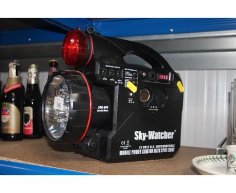 A Skywatcher 12v re-chargable mobile power station with spot light (lacking charger)