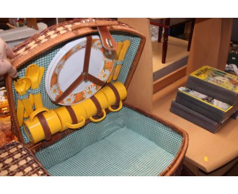 A wicker picnic hamper and contents 
