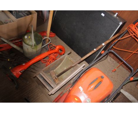 A cake crusher and a long handled roller