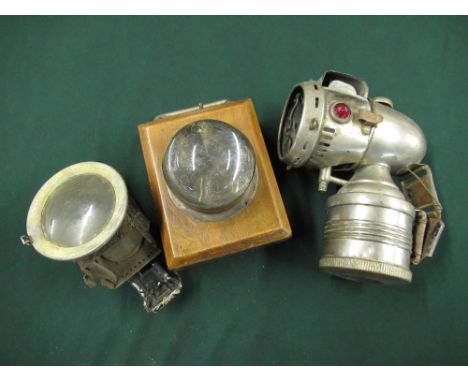 Wooden Bullseye cycle lamp, H12cm, Joseph Lucas Lugent lamp (missing burner base), H9cm, and another polished metal cycle lam