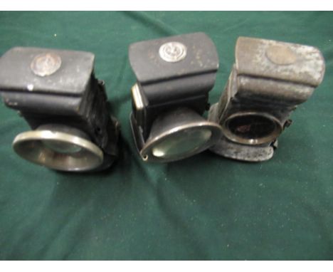 Three similar Lucas cycle lamps in black metal finish, two front lamps and one rear lamp (rear lamp glass damaged), H12cm (3)