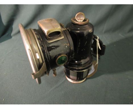 Joseph Lucas Calcia Major cycle lamp in black and metal finish (missing glass and mirror reflector broken), H16cm 