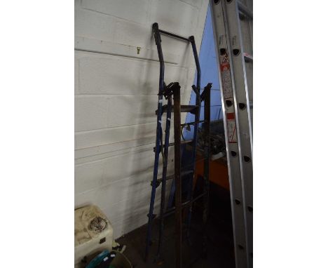 A stepladder and a metal ladder
