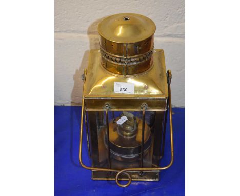 A brass framed hanging oil lantern