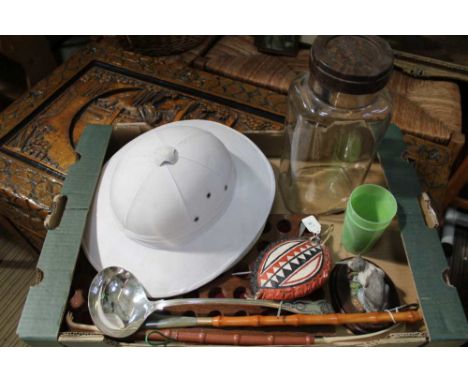 A BOX FULL OF DOMESTIC COLLECTABLES to include; an old pith helmet, silver-plated soup ladle, sweetie jar etc. 