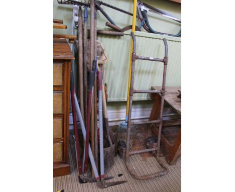 A VINTAGE METAL SACK TRUCK and A VINTAGE IRON BOUND CARTWHEEL together with a selection of predominantly garden tools and a s