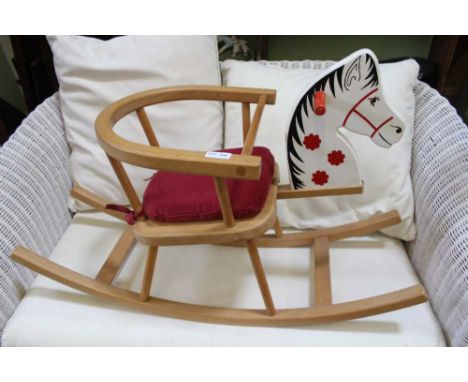 A BEECH FRAMED SMALL SIZED CHILD'S ROCKING HORSE 