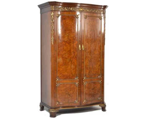 A Victorian 19th century rosewood serpentine fronted Maple &amp; Co double armoire wardrobe. Raised on bracket feet with an u