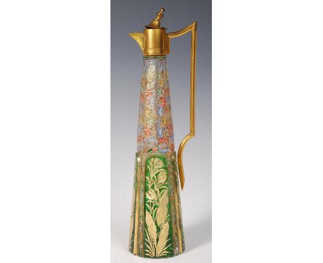 A 19th century continental Bohemian facet cut glass and overlay painted ewer jug. Of tapering form having green and gilt glas