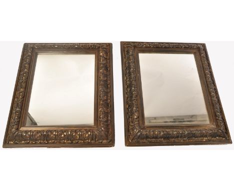 A pair of 19th century Biedermeier gilt wood cushion mirrors. Of gilt wood construction with stunning shaped design bearing g