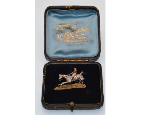 An early 20th century gold and diamond figural brooch. The brooch in the form of a steeplechase jockey having enamel decorati