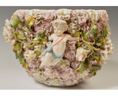 A 19th Century German Sitzendorf floral encrusted cherub planter - plant pot. Heavily encrusted all over with twin cherubs an