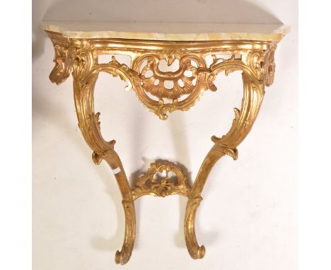 A 19th century French gilt wood bow front console table. The stunning base with  shaped legs united by a pierced stretcher, t