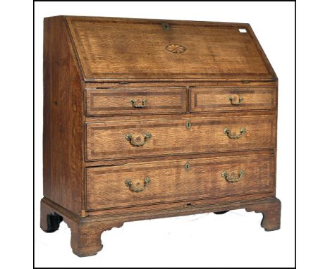 An 18th century North Country Lancashire bureau desk. Raised on bracket feet with a series of short and deep graduating drawe