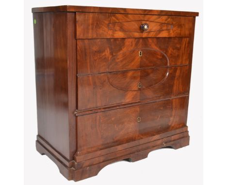 A 19th century walnut Biedermeier bachelors chest of drawers being raised on a step stub ogee bracket foot plinth base suppor