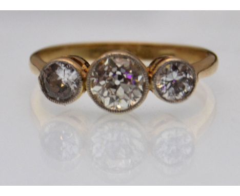 An 18ct gold and platinum three stone diamond ring having approx 1ct of diamonds with the central brilliant cut stone of appr