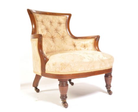 A late 19th century Victorian mahogany inlaid armchair of small proportions being raised on brown ceramic castors with ring t