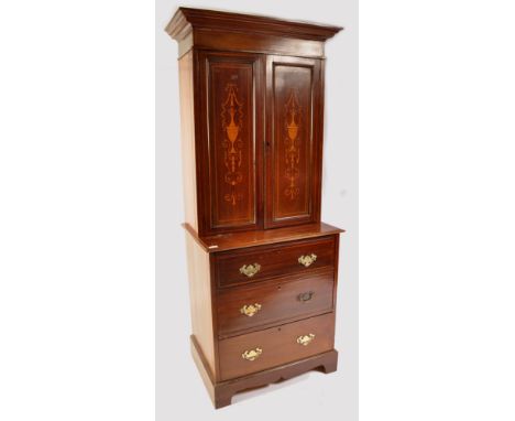 An Edwardian mahogany inlaid estate bookcase on chest of drawers. Raised on bracket feet with a bank of drawers having inlaid