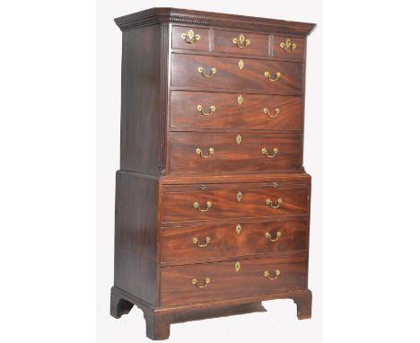 A 19th century Georgian bachelors mahogany chest on chest of drawers - tallboy. Raised on shaped bracket feet with a series o
