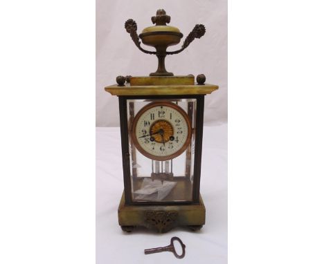 A French four glass and onyx mantle clock, white enamel dial with Arabic numerals, to include key and pendulum, 43.5cm