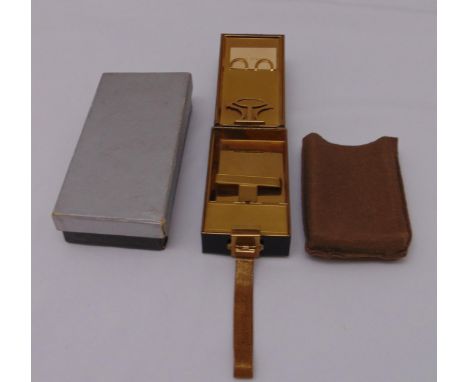 An Art Deco gilt metal and enamel minaudiere in fitted leather case