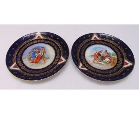 A pair of early20th century Vienna porcelain wall plates by Ackermann and Fritze decorated with classical scenes with a cobal