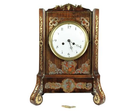 Circa 1790. Mahogany cabinet inlaid with silver, brass, and incized tortoise shell. Silk thread movement. Measurements: 8 1/4