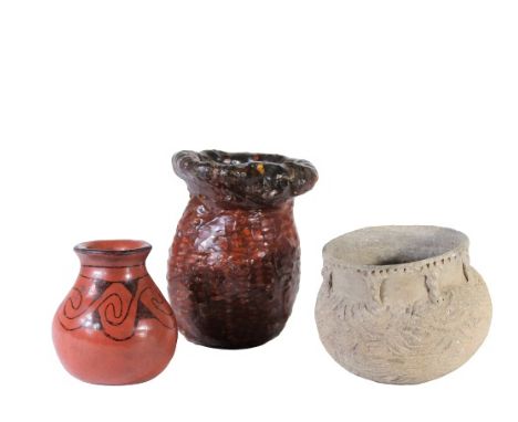 Three small jars, one burnished red with black slip design, label identifies it as Maricopa. The second jar is in a corn cob 