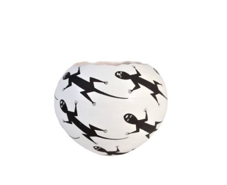 Native American white jar with a black lizard design, rim simulates that of a cracked eggshell. Signed Emma Lewis, Acoma. Mea