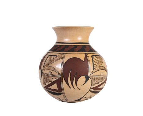 Tan burnished jar with red and black decoration, signed White Swann. White Swann (Dolly Joe Navasie) is a Hopi Potter of the 