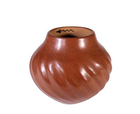 Beautifully burnished red vase with patterned impressions, signed Juanita Fragua, of Jemez Pueblo, New Mexico. Size: 5 in tal
